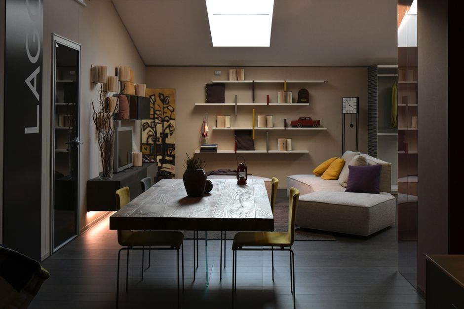 Contemporary living room design with wooden table, sofa, and shelves, perfect for home inspiration.